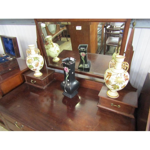 2077 - A 1930's mahogany dressing chest with bevelled mirror back