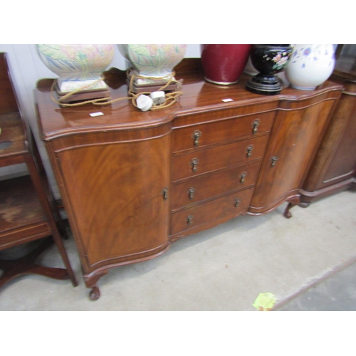 2191 - A 1940's walnut four drawer sideboard on cabriole legs    (E) £20-30