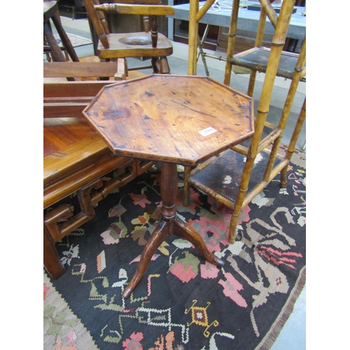 2208 - A 19th Century elm tripod wine table