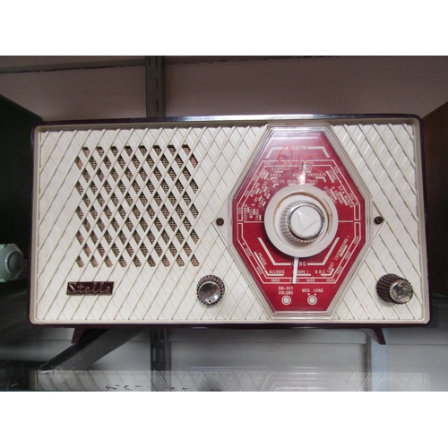 7013 - A Stella ST110 AC/DC table top valve radio in maroon plastic case with cream front, serial number 8A... 