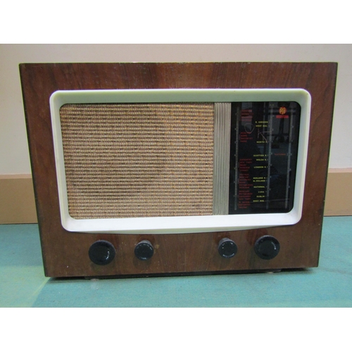 7028 - A Pye model 15A AC mains operated table radio housed in a walnut veneered wooden case, serial number... 