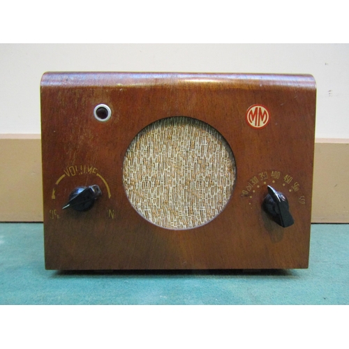 7033 - A G.E.R 'Mightly Midget' valve radio in walnut veneered wooden casing. C.1949
