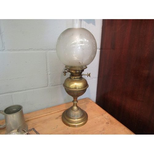 1038 - An early 20th Century brass oil lamp with Hinks No 2 safety burner, decorative globular shade