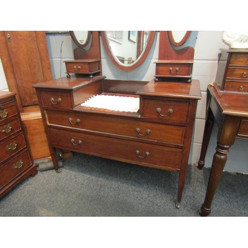 1055 - An Edwardian mahogany dressing table with triple oval mirrors. 170cm high x 111cm wide x 50cm deep  ... 