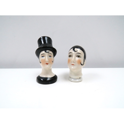 1340 - Two porcelain female cushion heads, lady wearing top hat and pierrette 6cm & 5cm tall