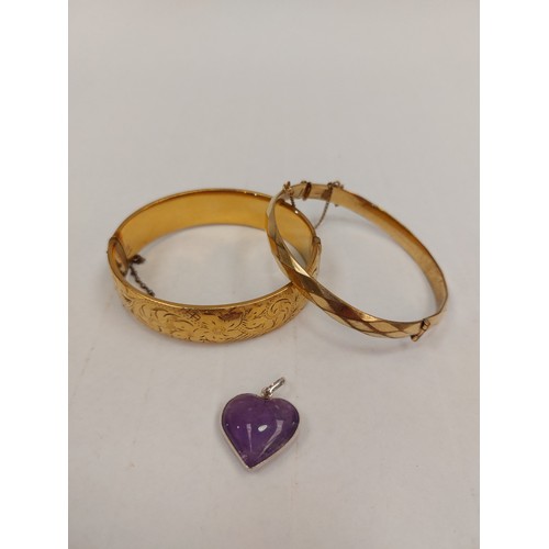 1296 - A 1/5 9ct gold bangle with metal core, another rolled gold bangle and heart pendant marked 950 set w... 