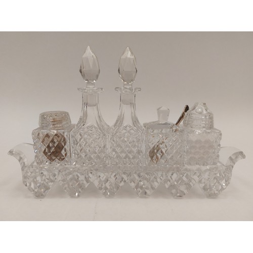 1297 - A crystal glass cruet set with a silver spoon