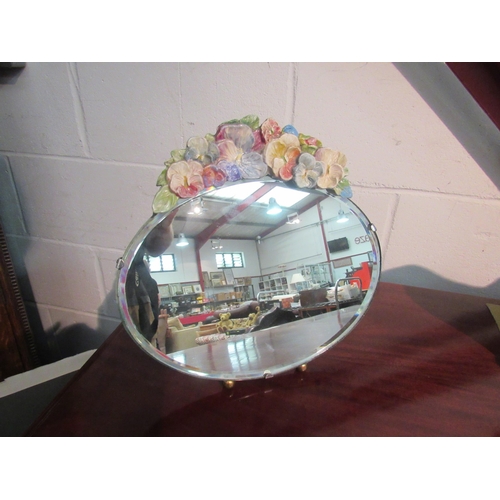 1006 - A decorative oval barbola mirror