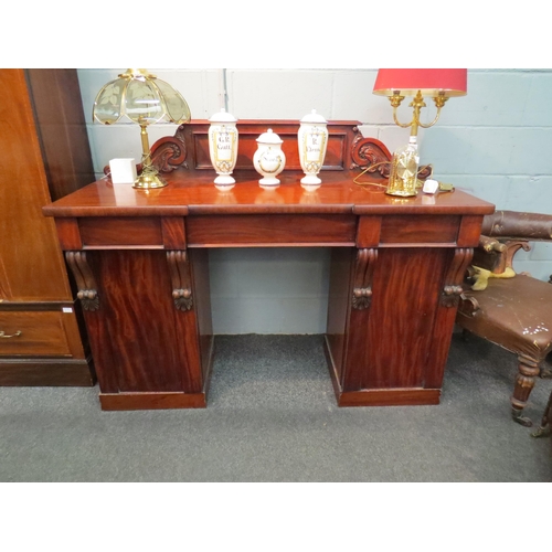 1050 - A mahogany sideboard with three drawers and wine cupboard within pedestal, 117cm high x 153cm wide x... 