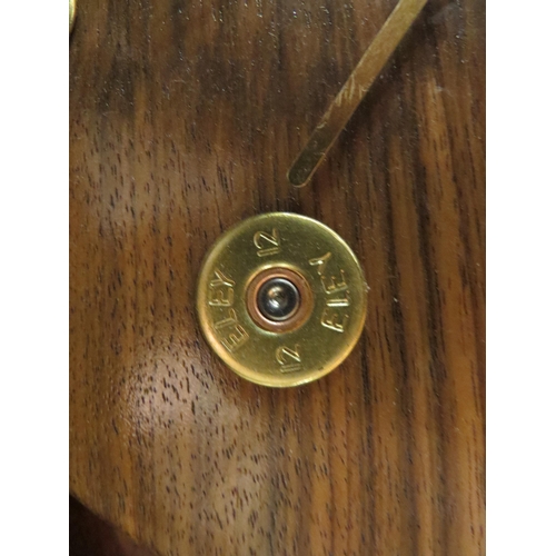 1056 - A shotgun cartridge design wall clock, 30cm diameter