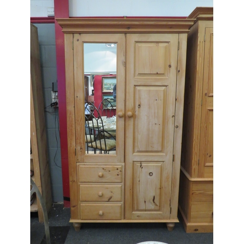 1059 - A natural pine compactum wardrobe with mirrored door over three drawers and full height door, 190cm ... 