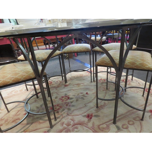 1085 - A circular glass table on iron base with a set of six iron frame arch chairs