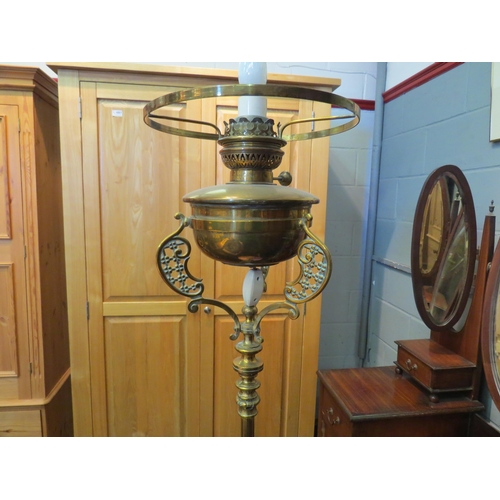 1090 - A late Victorian brass standard oil lamp, converted to electric    (E) £20-30