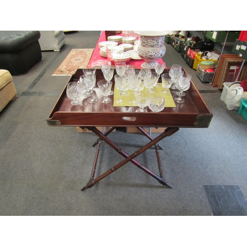 1545 - A 19th Century mahogany butler’s tray with ring turned support base