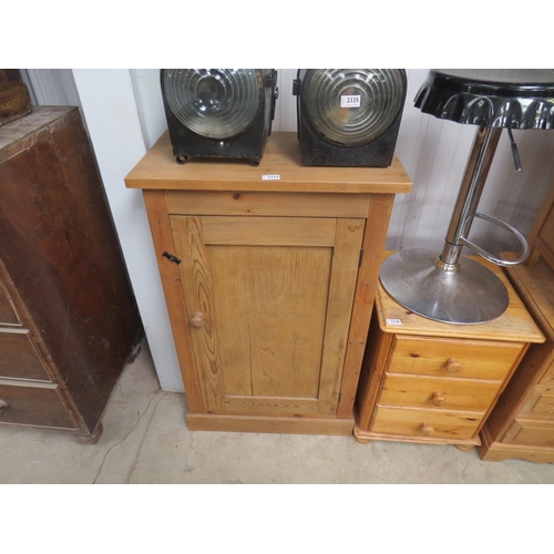 2334 - A country pine single door cupboard, shelved interior