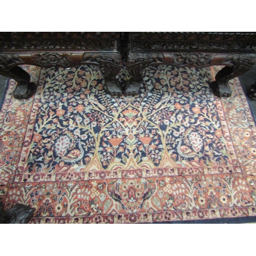 1023 - An early 20th Century tree of life wool rug with tasselled ends, 200cm x 124cm