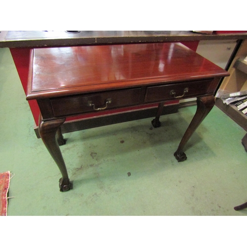 4001 - A 19th Century mahogany side table the two frieze drawers over cabriole legs on ball in claw feet. 7... 