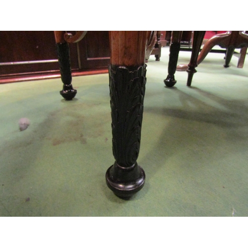 4054 - A satin walnut Biedermeier circular top table over turned and tapering legs on carved ebonised feet ... 