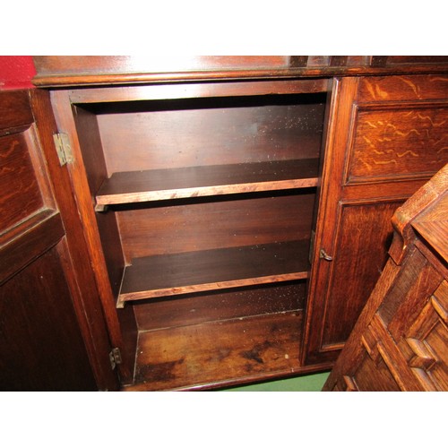 4162 - An Arts & Crafts oak two door wall cupboard with working lock and key (formerly housed a dartboard) ... 