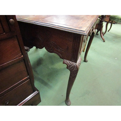 4089 - An early 1800's oak three drawer side table with carved decoration. Cabriole legs to pad feet. 68cm ... 