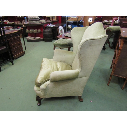 4152 - A Georgian hump backed wing armchair on shell carved cabriole feet     (R) £70