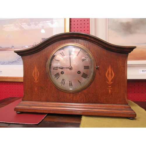 4028 - An early to mid 20th Century oak mantel clock, two train movement striking on a coiled gong, 28cm x ... 