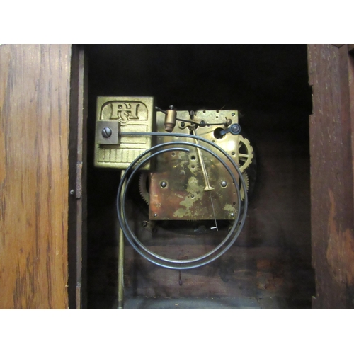 4028 - An early to mid 20th Century oak mantel clock, two train movement striking on a coiled gong, 28cm x ... 