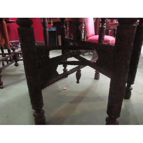 4057 - A circa 1900 Indian hexagonal occasional table with carved base, later top, 72cm diameter     (E) £2... 