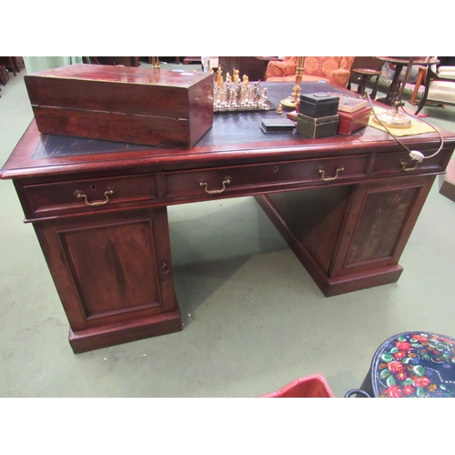 4096 - A 19th Century mahogany twin pedestal partner's desk the gilt tooled leather insert over twelve draw... 