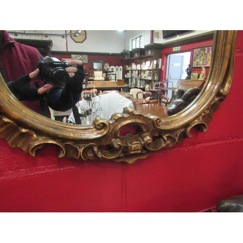 4112 - An ornate gilt frame wall mirror, 115cm high x 82cm wide total     (R) £60