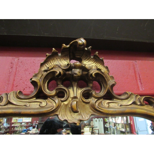 4112 - An ornate gilt frame wall mirror, 115cm high x 82cm wide total     (R) £60