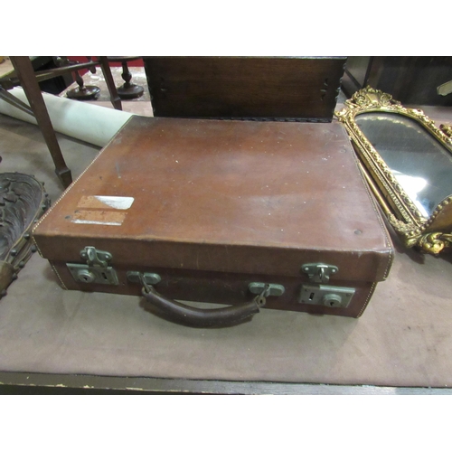 4199 - A leather suitcase with label to interior 