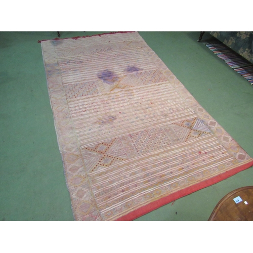 4420 - An Eastern hand woven geometric design rug, badly stained, a/f,     (R) £35