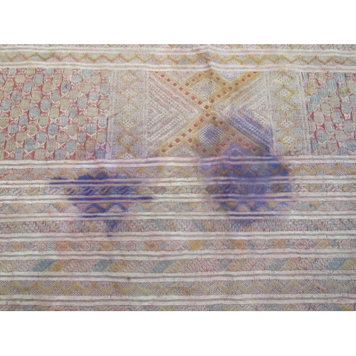 4420 - An Eastern hand woven geometric design rug, badly stained, a/f,     (R) £35