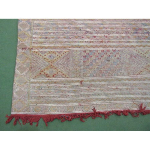 4420 - An Eastern hand woven geometric design rug, badly stained, a/f,     (R) £35