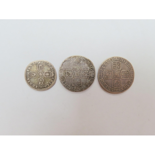 9010 - A 1696 William III sixpence, together with shillings of Queen Anne, 1708 & George I, 1720