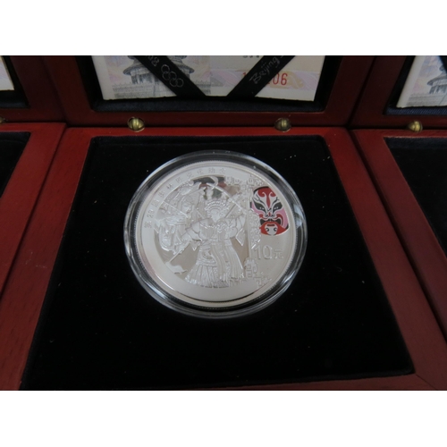 9037 - Four 2008 Beijing XXIX Olympiad silver coins, each boxed with certificates (Red)