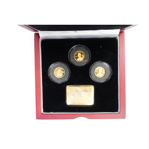 9110 - A boxed 'Year of Three Kings' gold crown set of three coins and plaque No. 213 of 499