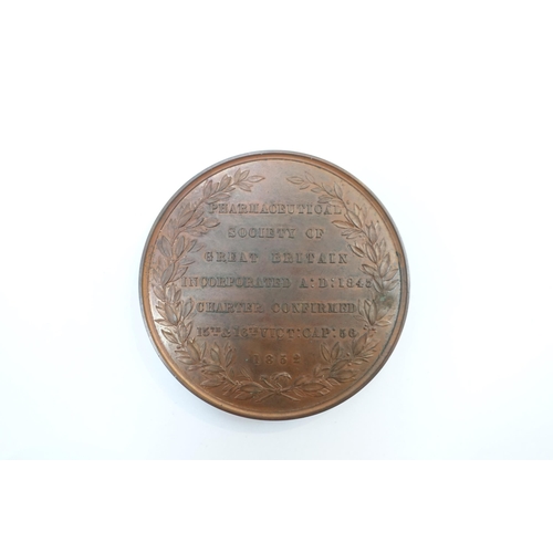 9113 - A cased Pharmaceutical Society of Great Britain bronze medal designed by L.C Wyon and awarded to Aub... 