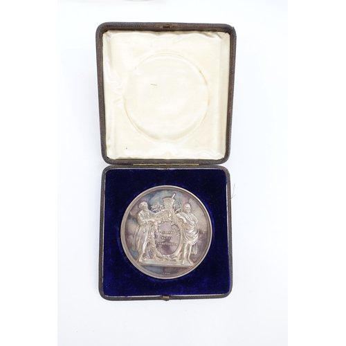 9114 - A cased Pharmaceutical Society of Great Britain silver medal designed by L.C Wyon and awarded to Aub... 