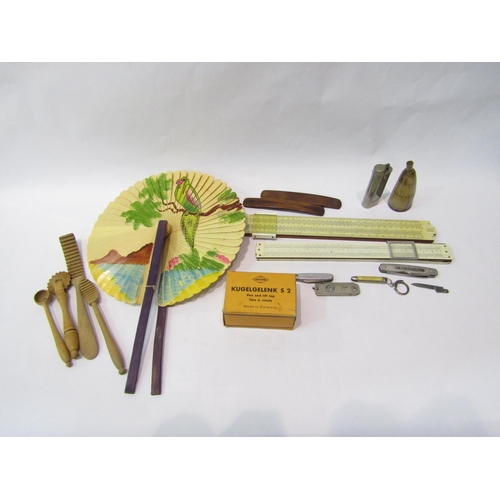 4266 - Two cased slide rules, a hand-painted fan, wooden kitchen utensils, horn powder flask a/f, two bone ... 