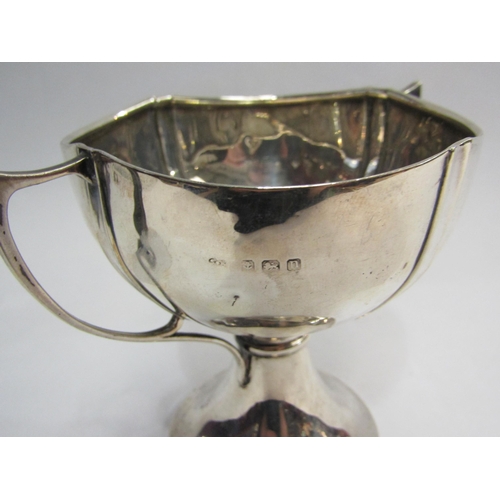 4312 - A two handled silver trophy form bowl, dented, 10cm high