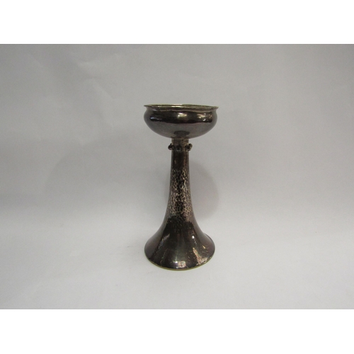 4316 - An Arts & Crafts silver William Hutton & Sons Ltd hammered candlestick, London, 1902 (17.75cm high, ... 