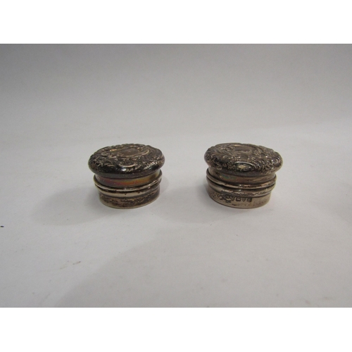 4326 - Two yellow metal lorgnettes, together with two silver pill boxes (4)