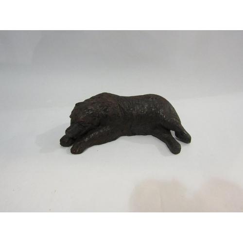 4022 - A recumbent carved wooden Black Forest bear, 21cm long