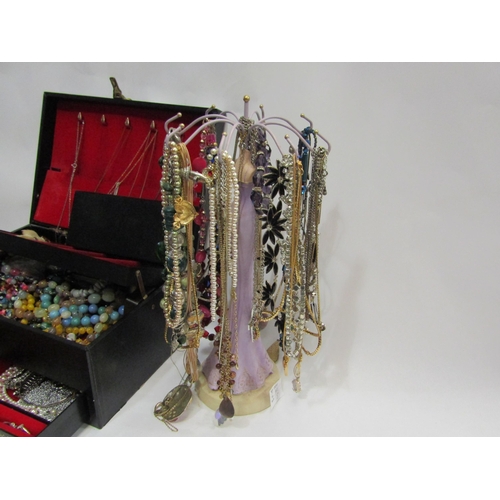 4356 - A large quantity of bijouterie on stand, cased and in jewellery box, necklaces, rings, brooches