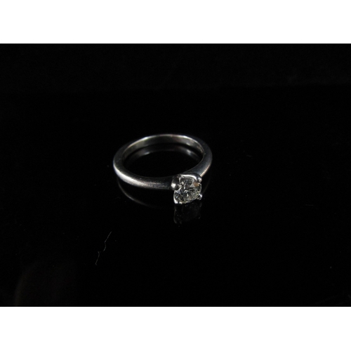 6236 - A platinum set diamond solitaire ring 0.38ct approx, in four claw setting. Size J/K , 3.8g, with cop... 