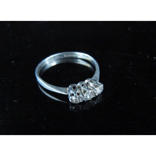 6032 - A three stone diamond ring on platinum shank, 0.28ct total approx. Size K, 1.8g