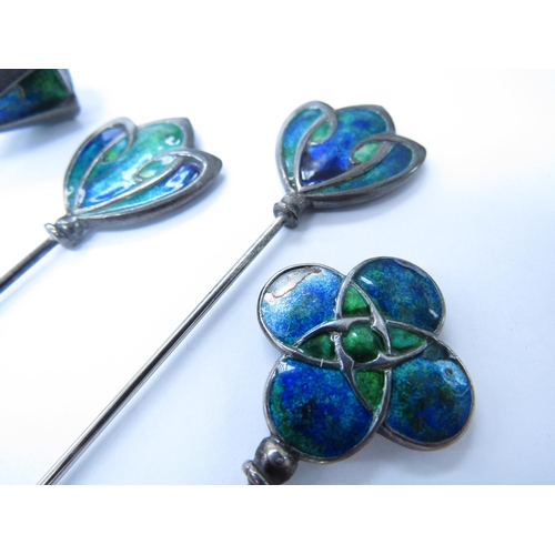 6053 - Four Art Nouveau enamelled hatpins in blues and green, unmarked