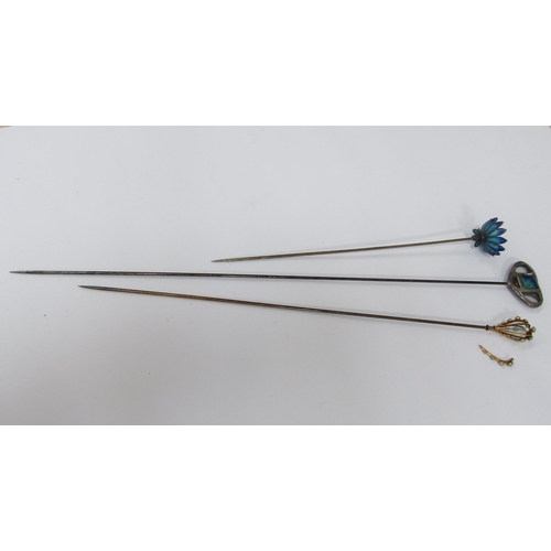 6059 - Three hatpins including a flower with glass petals in blues, Art Nouveau enamelled heart shaped, sta... 